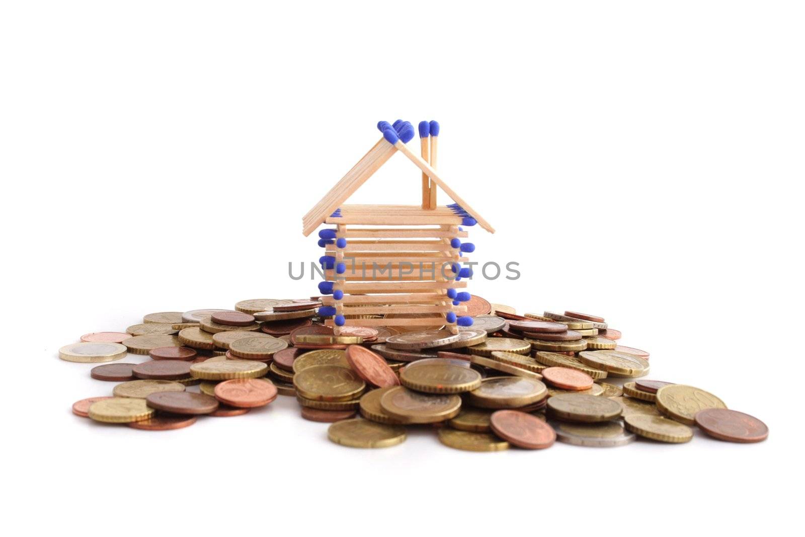 A tinkered house standing on a a lot of cash. All isolated on white background.