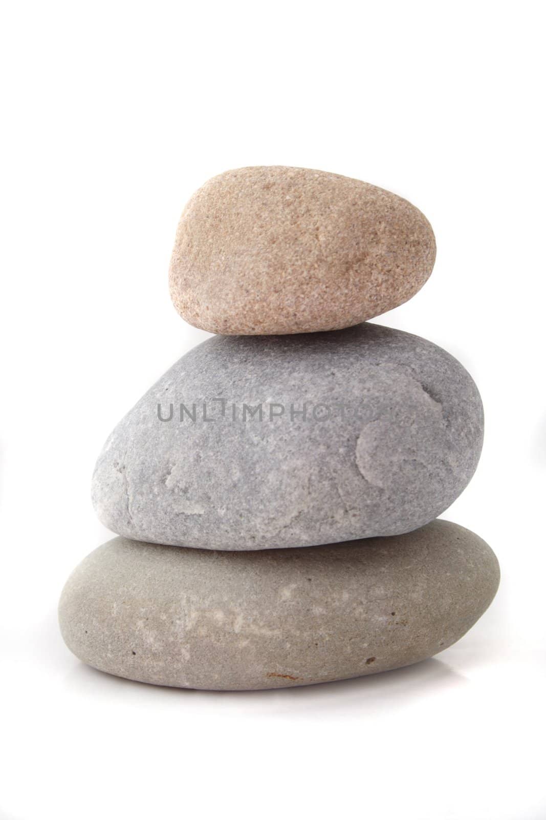 Three fine polished rocks lying one upon another. All isolated on white background.