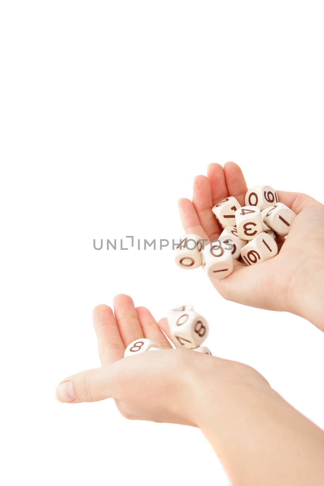 A human hand rolling several dices. All isolated on white background.