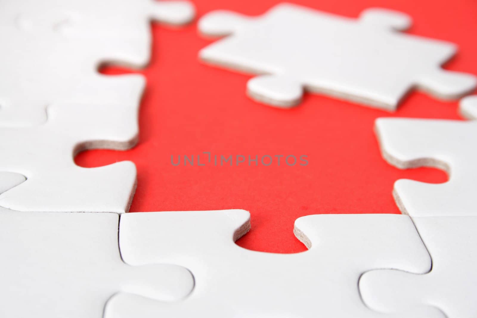 A jigsaw puzzle with a red gap.