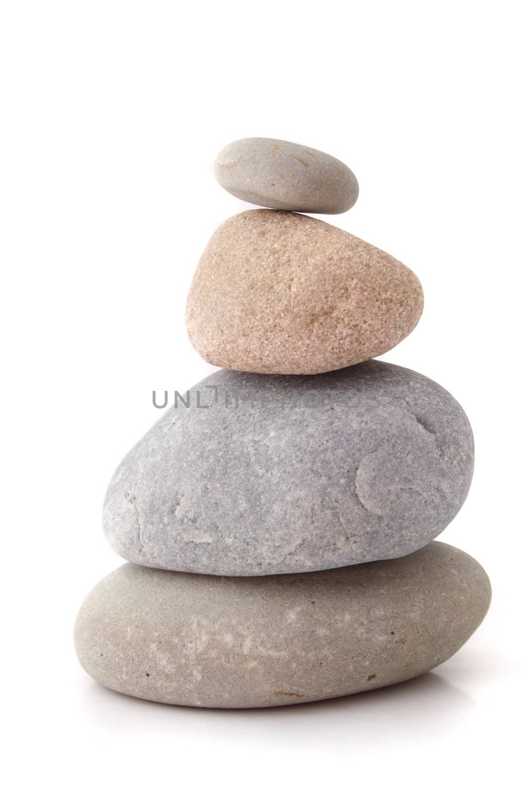 Four fine polished rocks lying one upon another. All isolated on white background.