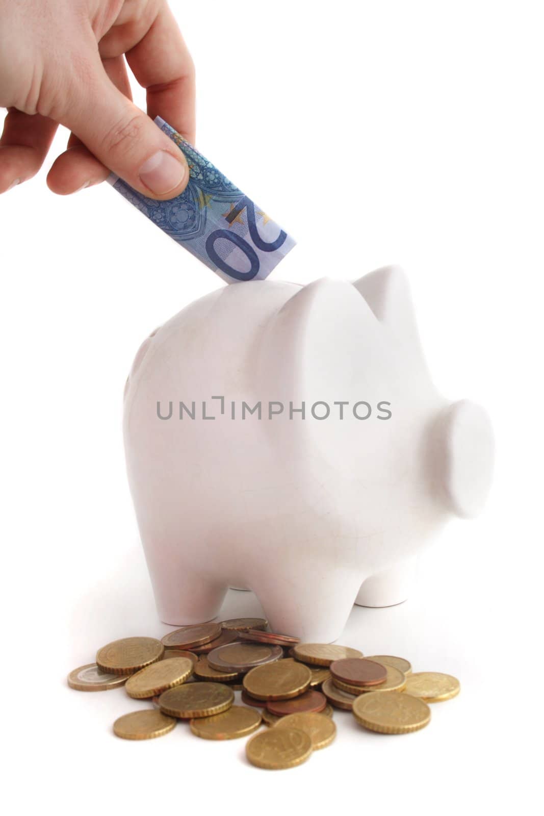 A person saves money in a piggybank. All isolated on white background.