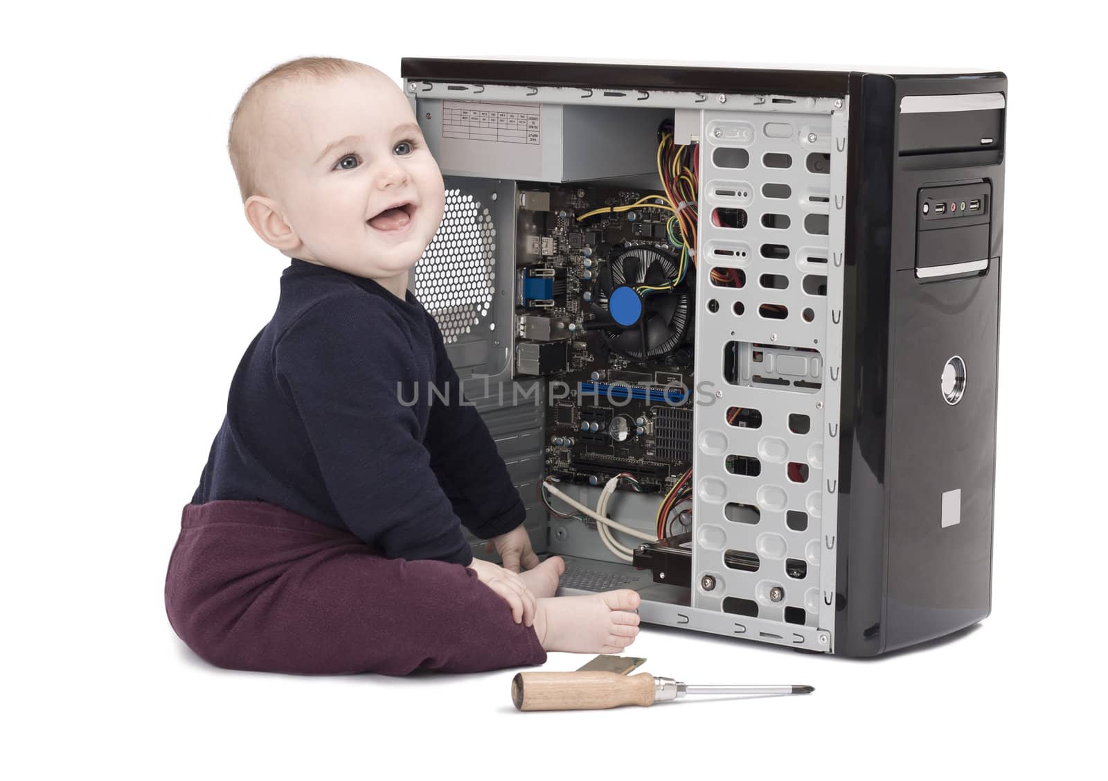 young child in blue shirt with open computer on white background