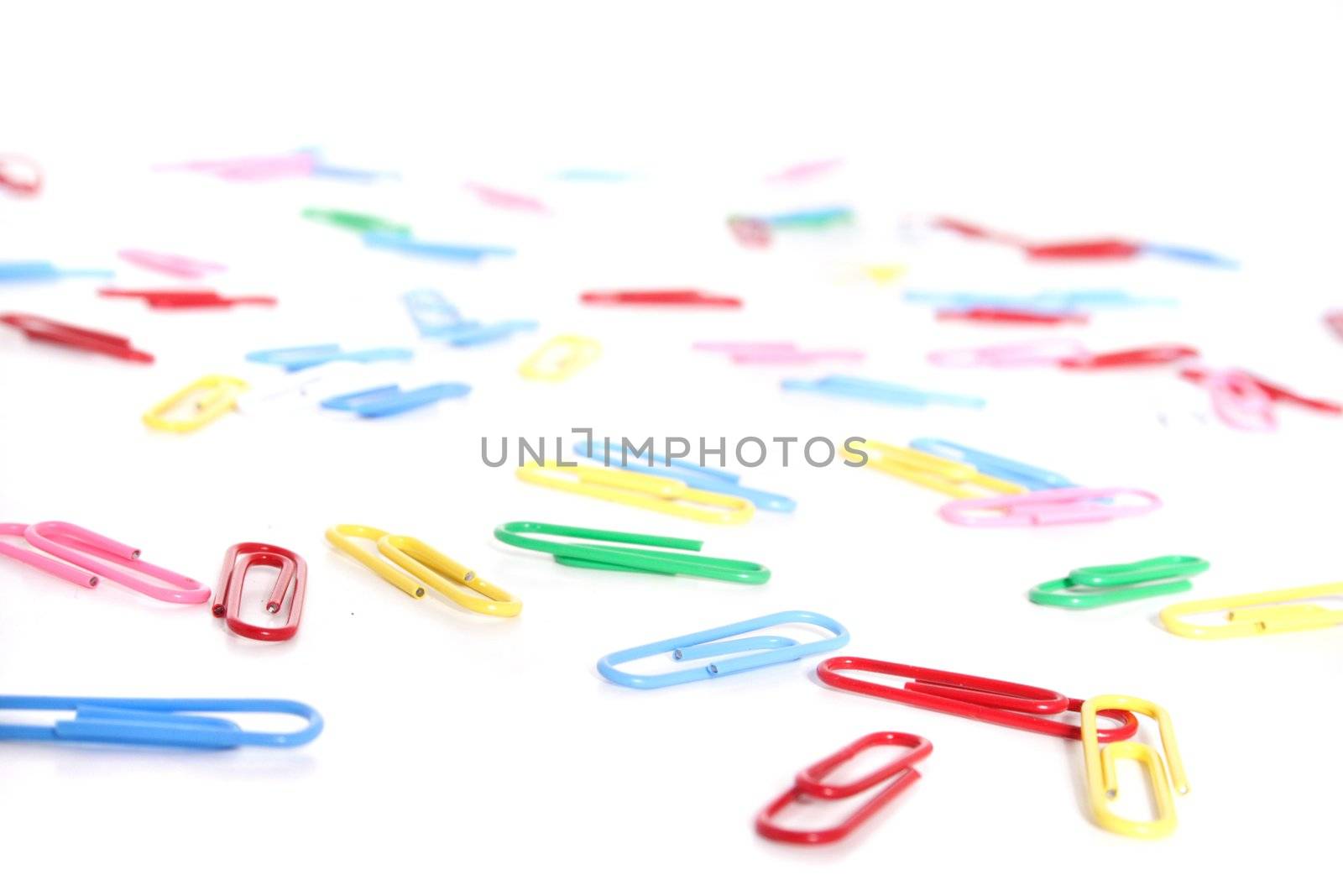 Several paperclip in different colors. All on white background.