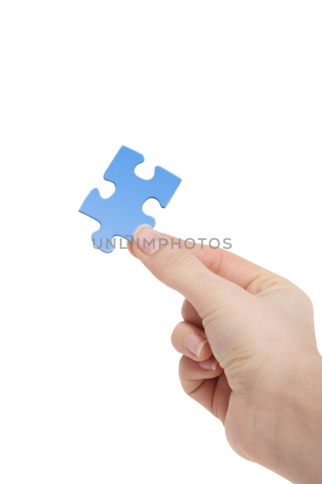 A person holding a blue piece of a puzzle in his hand. All on white background.