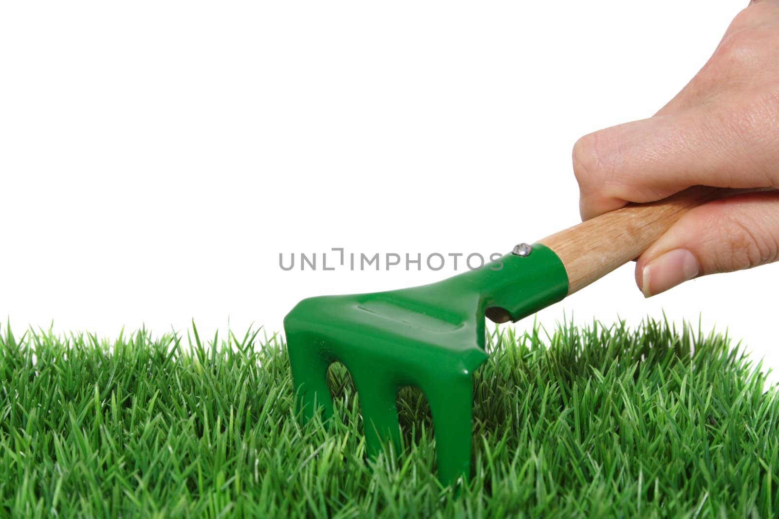 A green keeper during his work. All on white background.