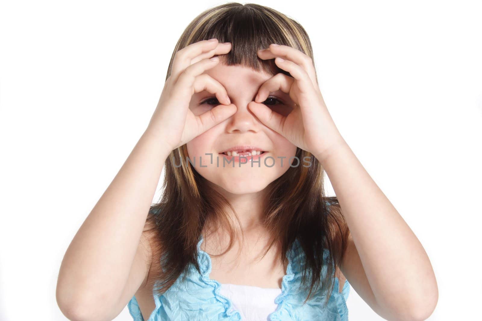 A young girl tries to get a better perspective. All isolated on white background.