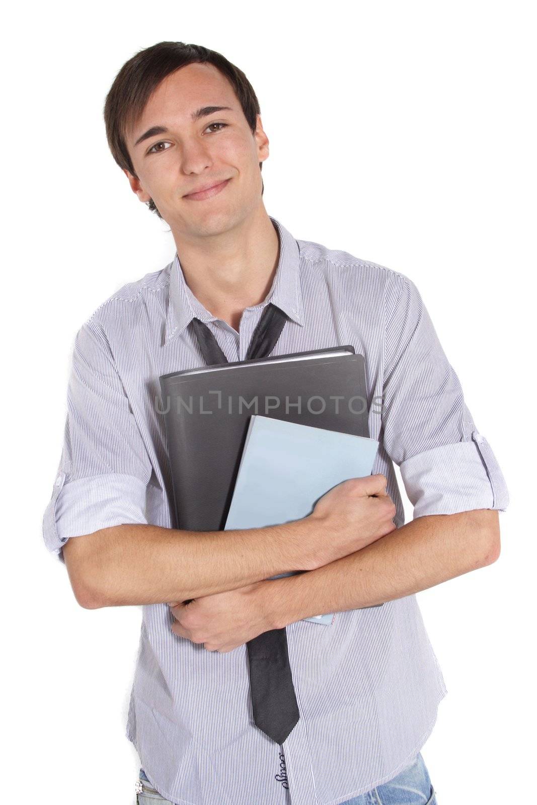 A handsome student holding his documents while standing in front of a white background.