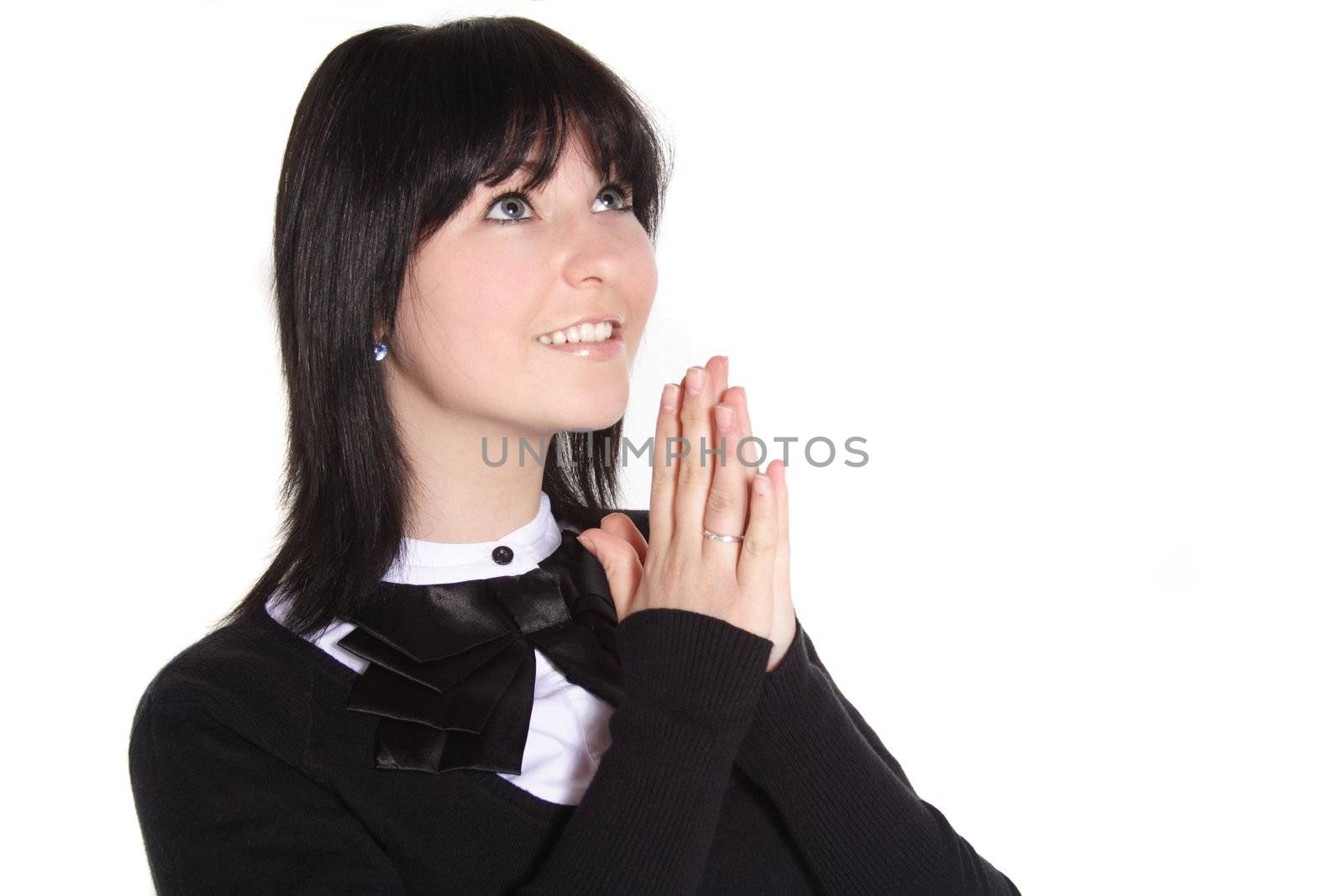 An attractive young woman prays. All  isolated on white background.