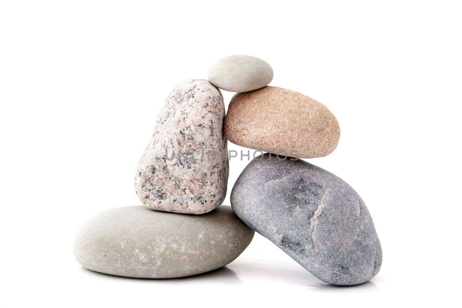 Several rocks lying one upon another.All isolated on white background.