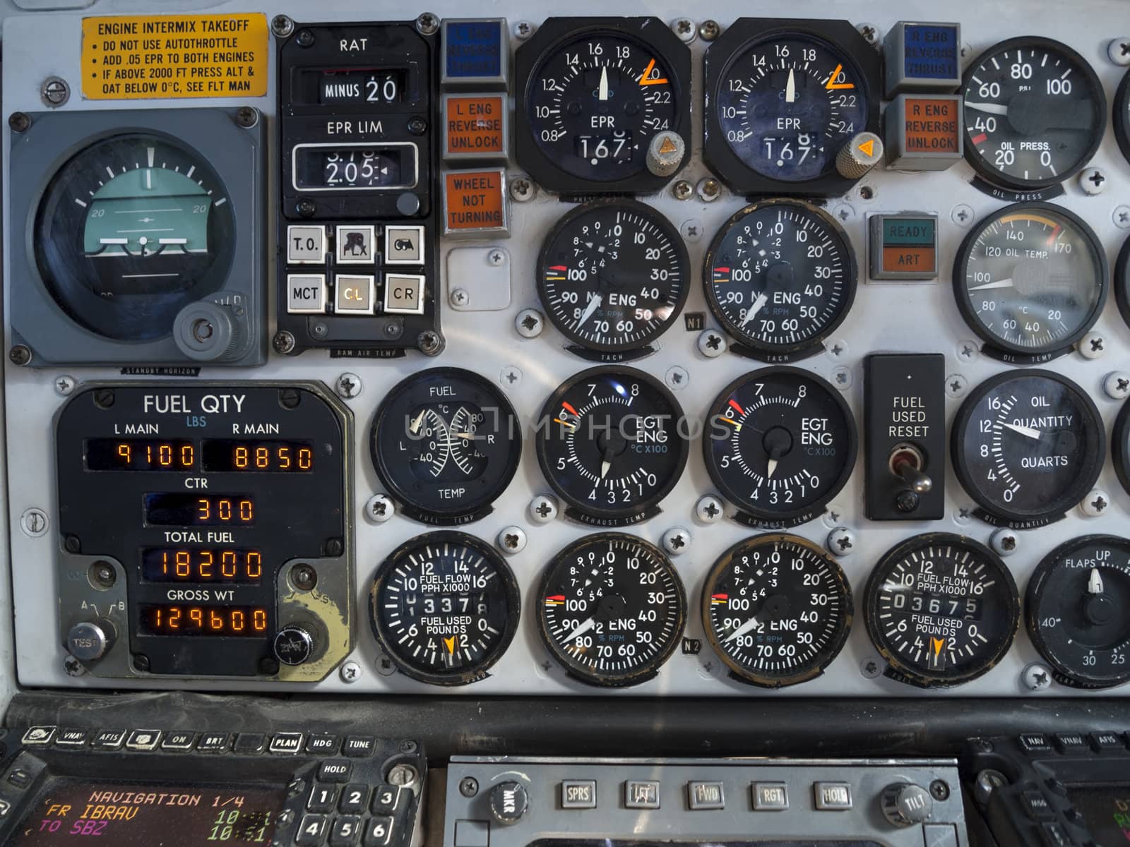 Aircraft cockpit: engine and fuel instruments in flight.