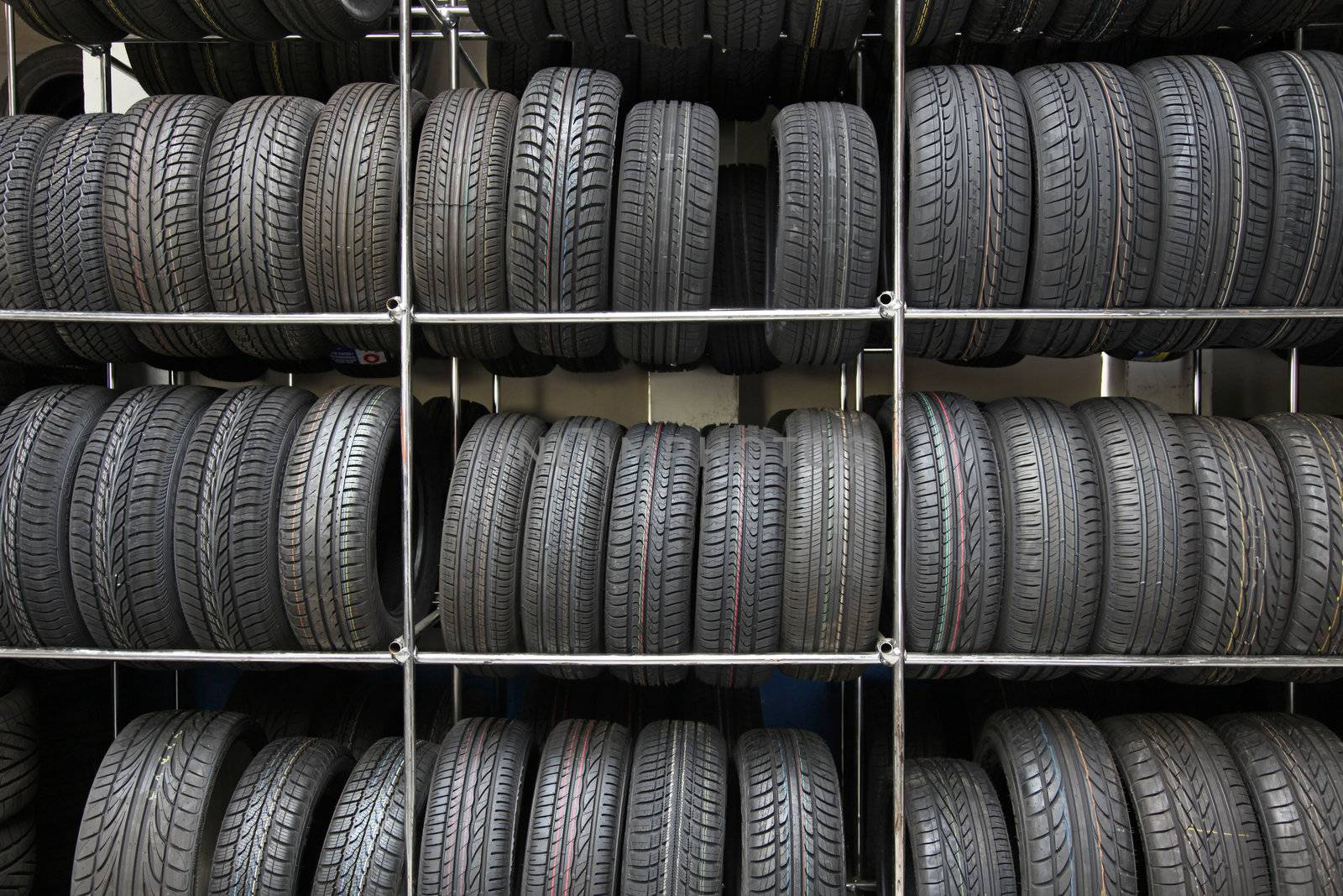 A rack full of tires in a tire workshop.