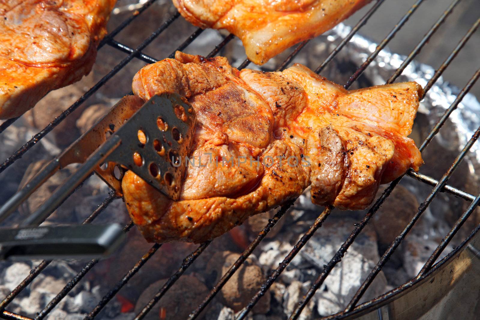 A nice grill barbecue with delicious marinaded steaks.