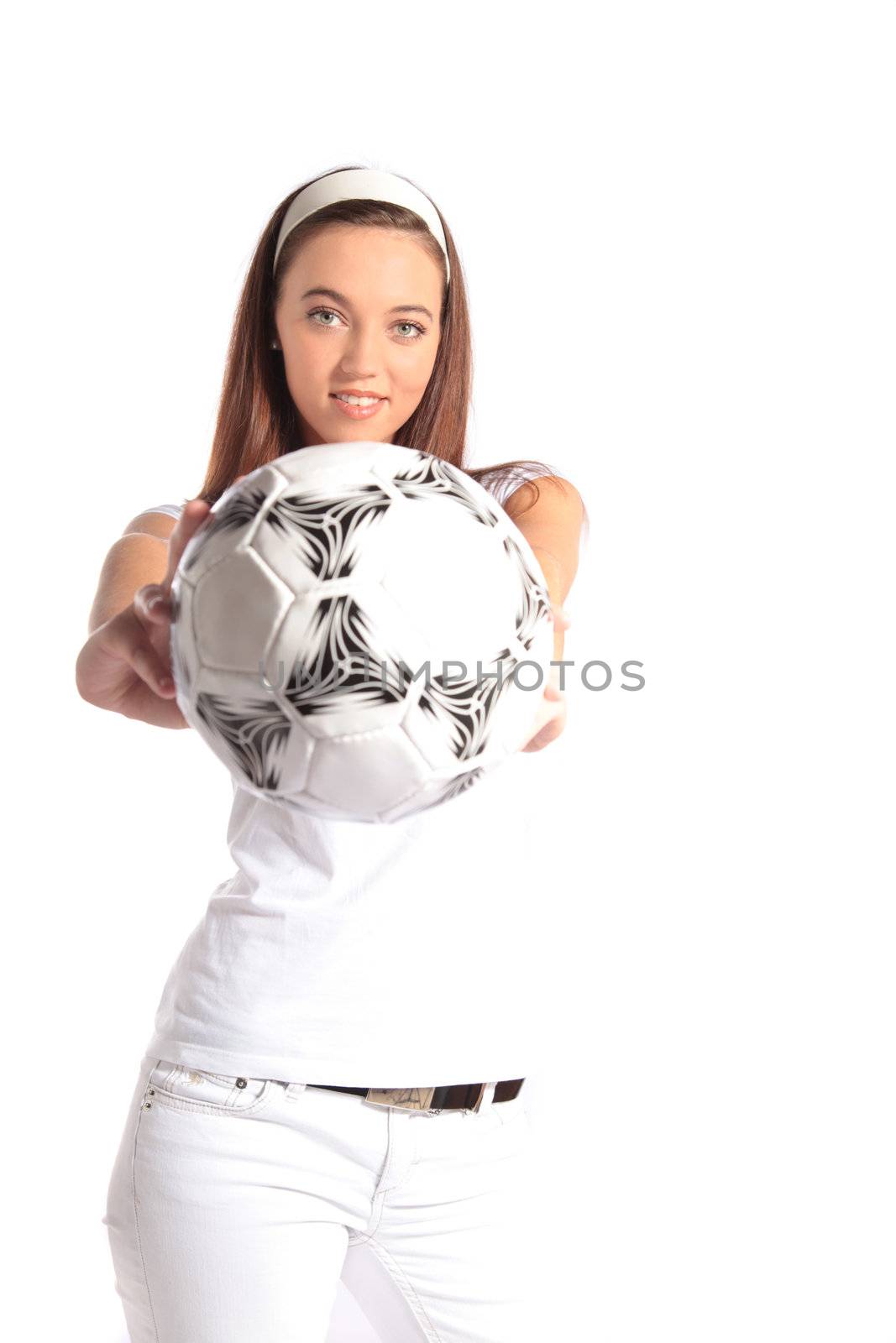 An attractive young woman holding a soccer ball. All isolated on white background.