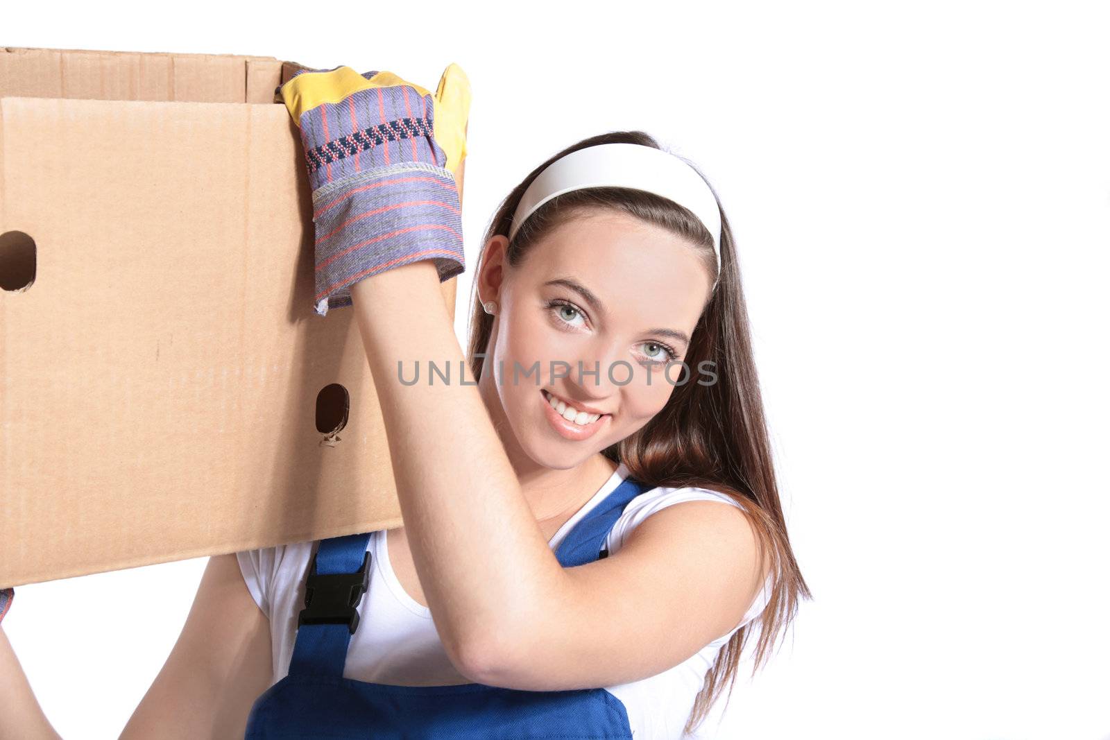 An attractive young woman carrying a moving box. All isolated on white background.