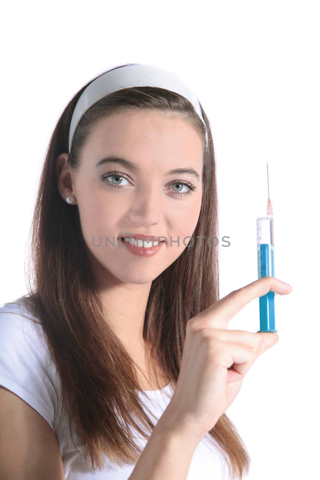 An attractive young woman holding a syringe. All isolated on white background.