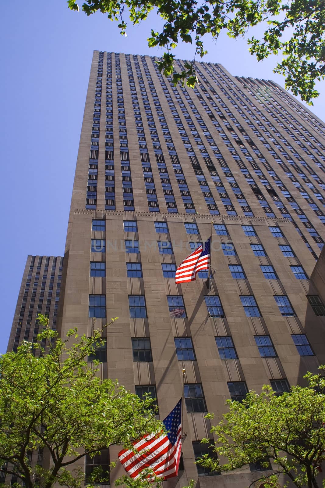 New York City Building With Flags Eary Morning by bill_perry