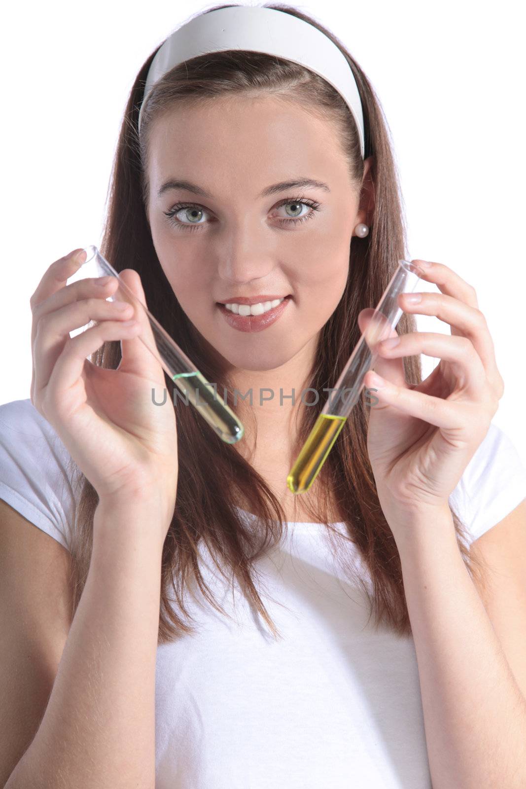 An attractive chemistry student holding two test tubes. All isolated on white background.