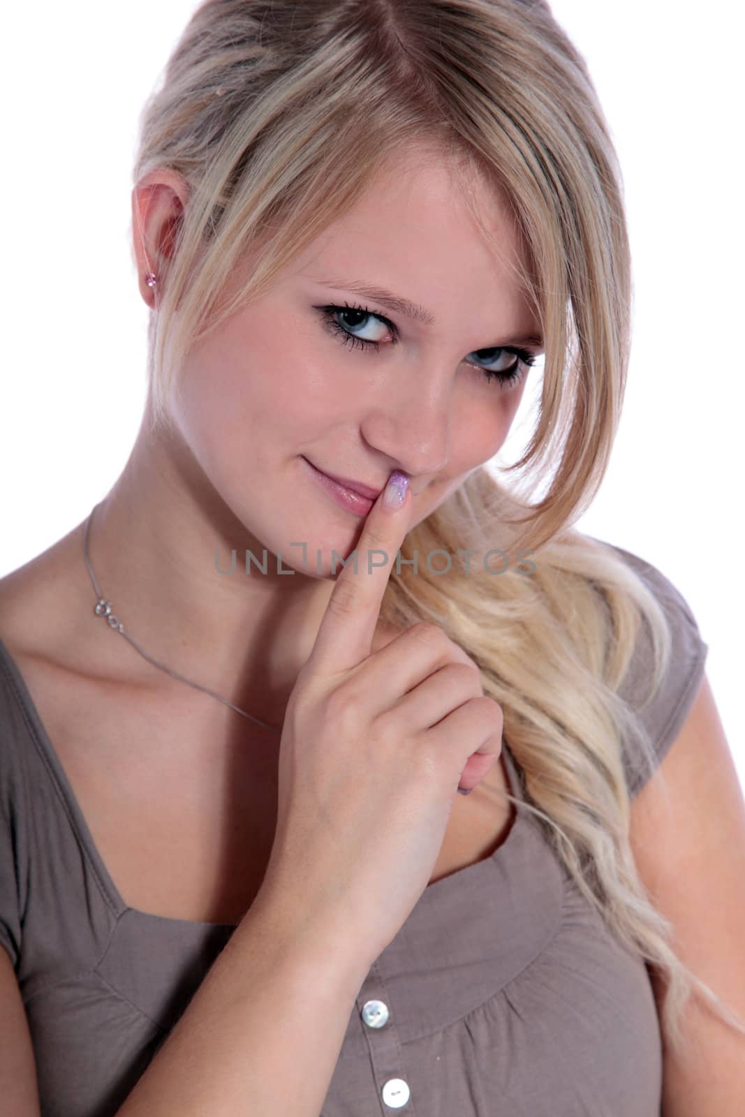 An attractive young woman asks for silence. All on white background.