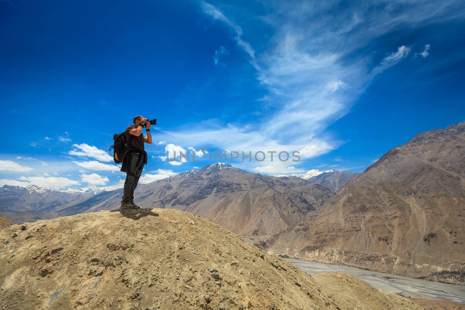 Photographer taking photos in Himalayas  by dimol