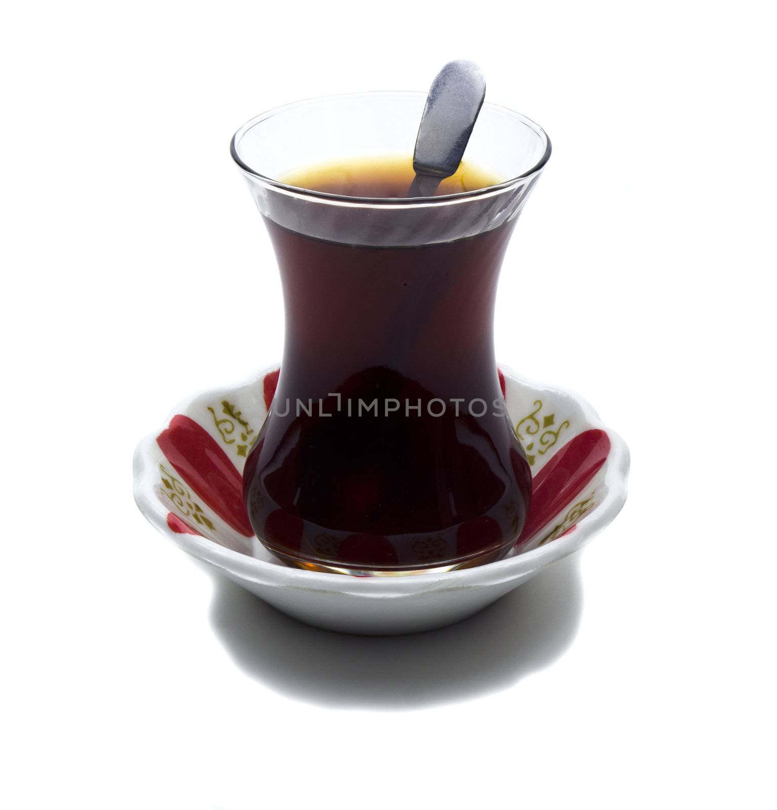 Brewed tea mixed with sugar spoon