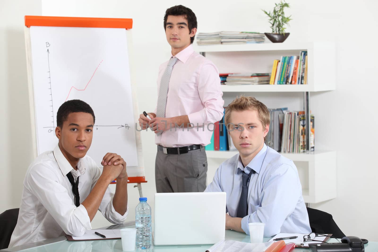 young businessmen on a meeting by phovoir
