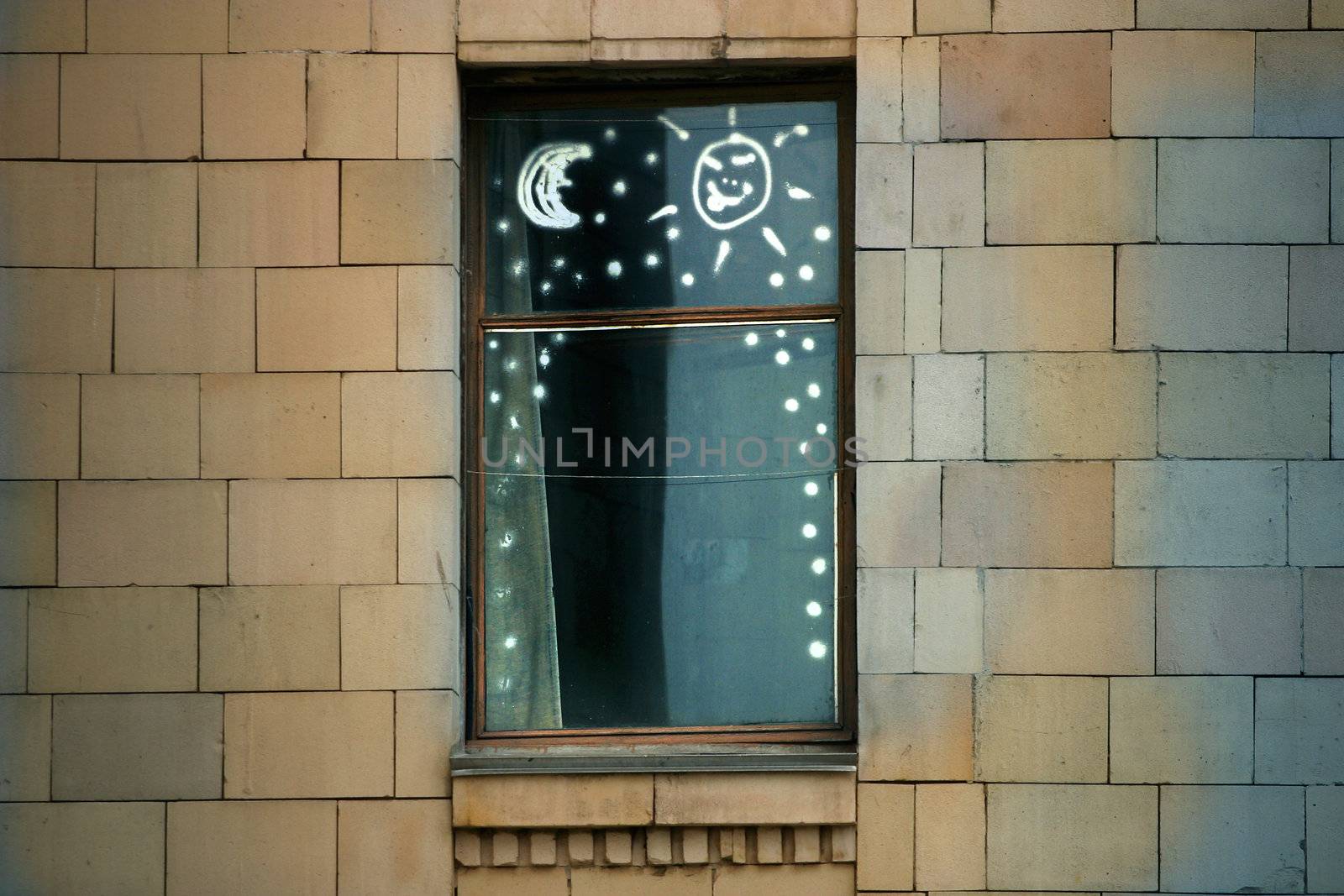 Window with children's figure on glass