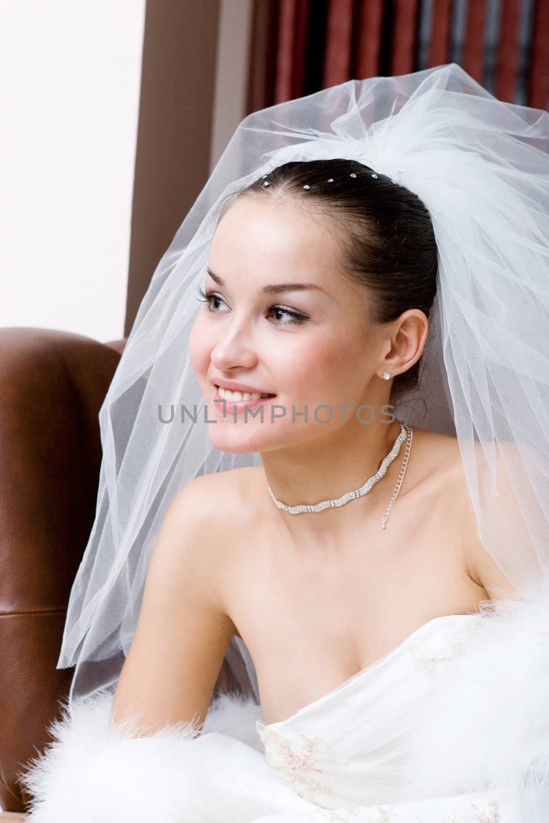 a young happy bride looks forward
