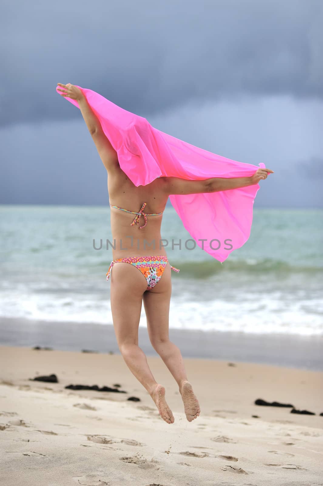 Woman enjoying the beach in Brazil, Salvador de Bahia.