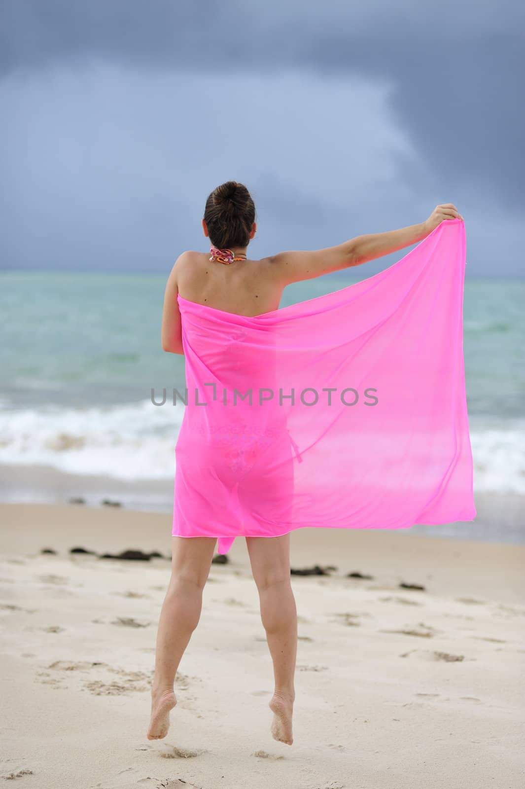 Woman enjoying the beach in Brazil, Salvador de Bahia.