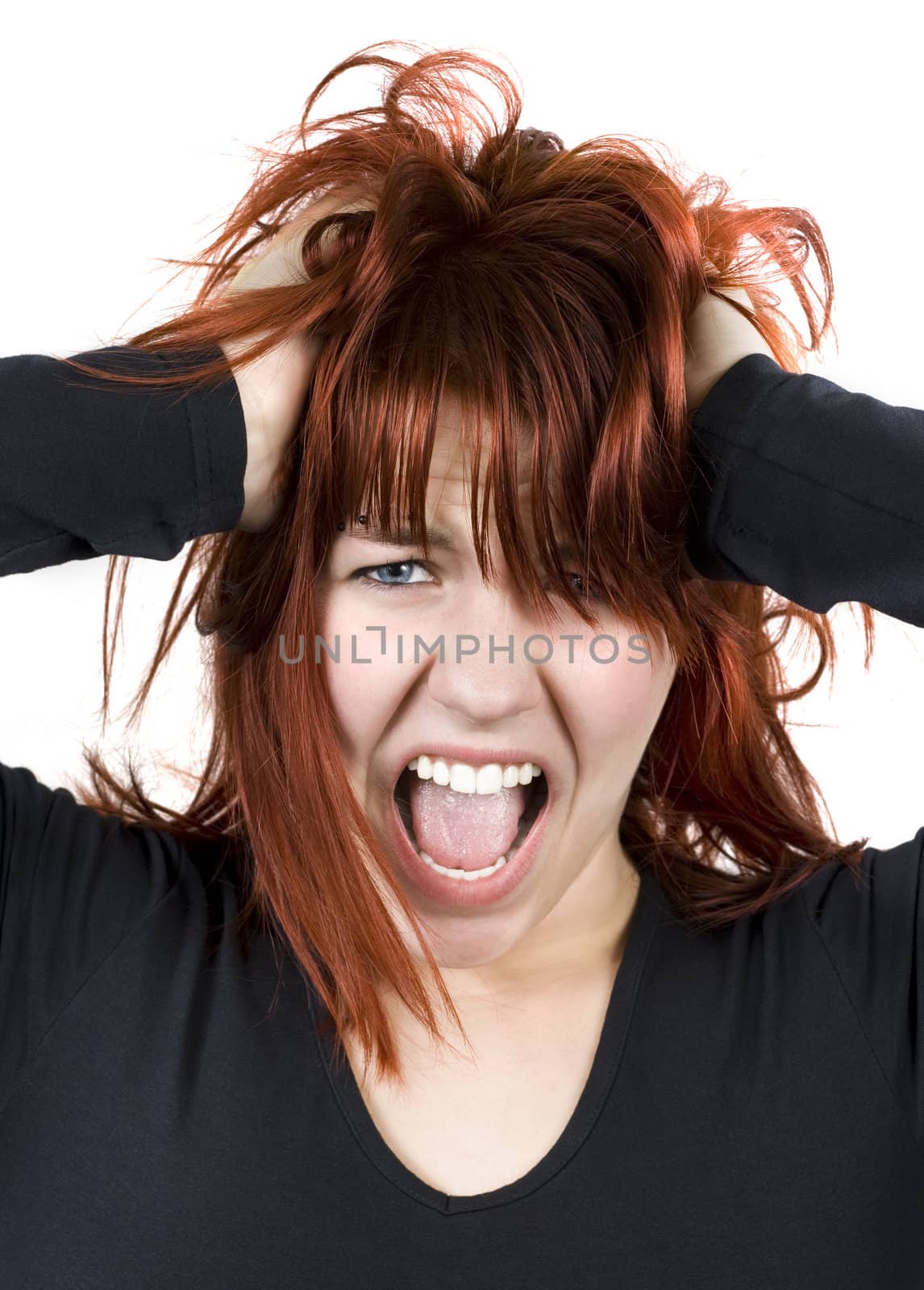 Frustrated modern business female shouting out her annoyance.

Studio shot.
