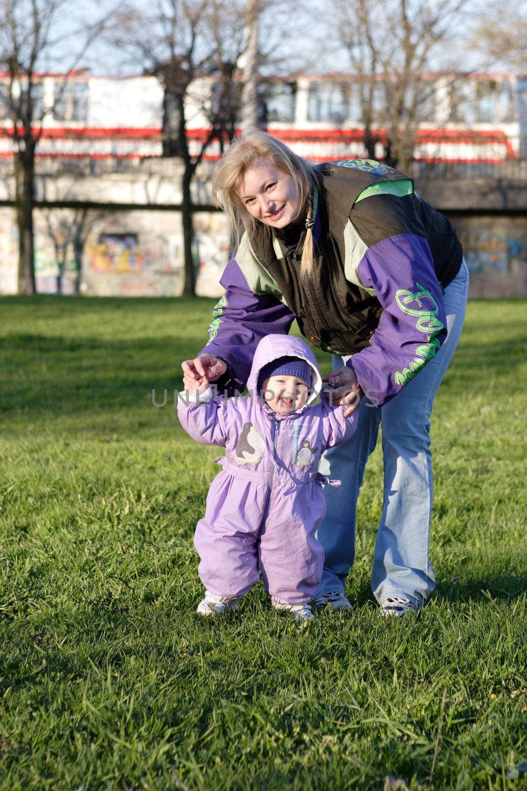 mother and child of one year old outdoors