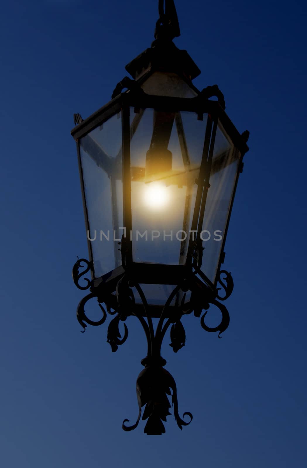 Old, turned on the lamp. Night. by wojciechkozlowski