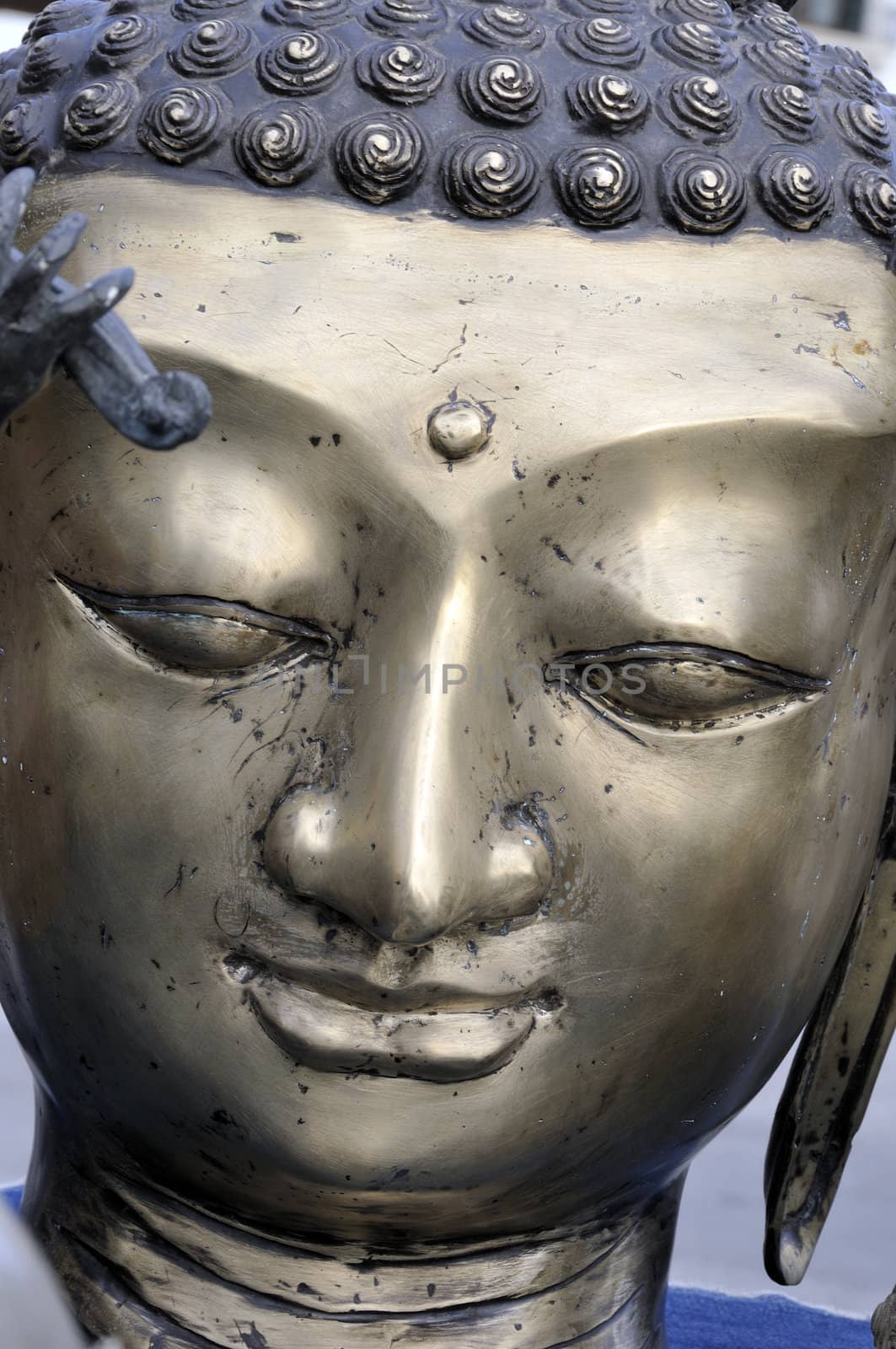 Buddha face, bronze statue