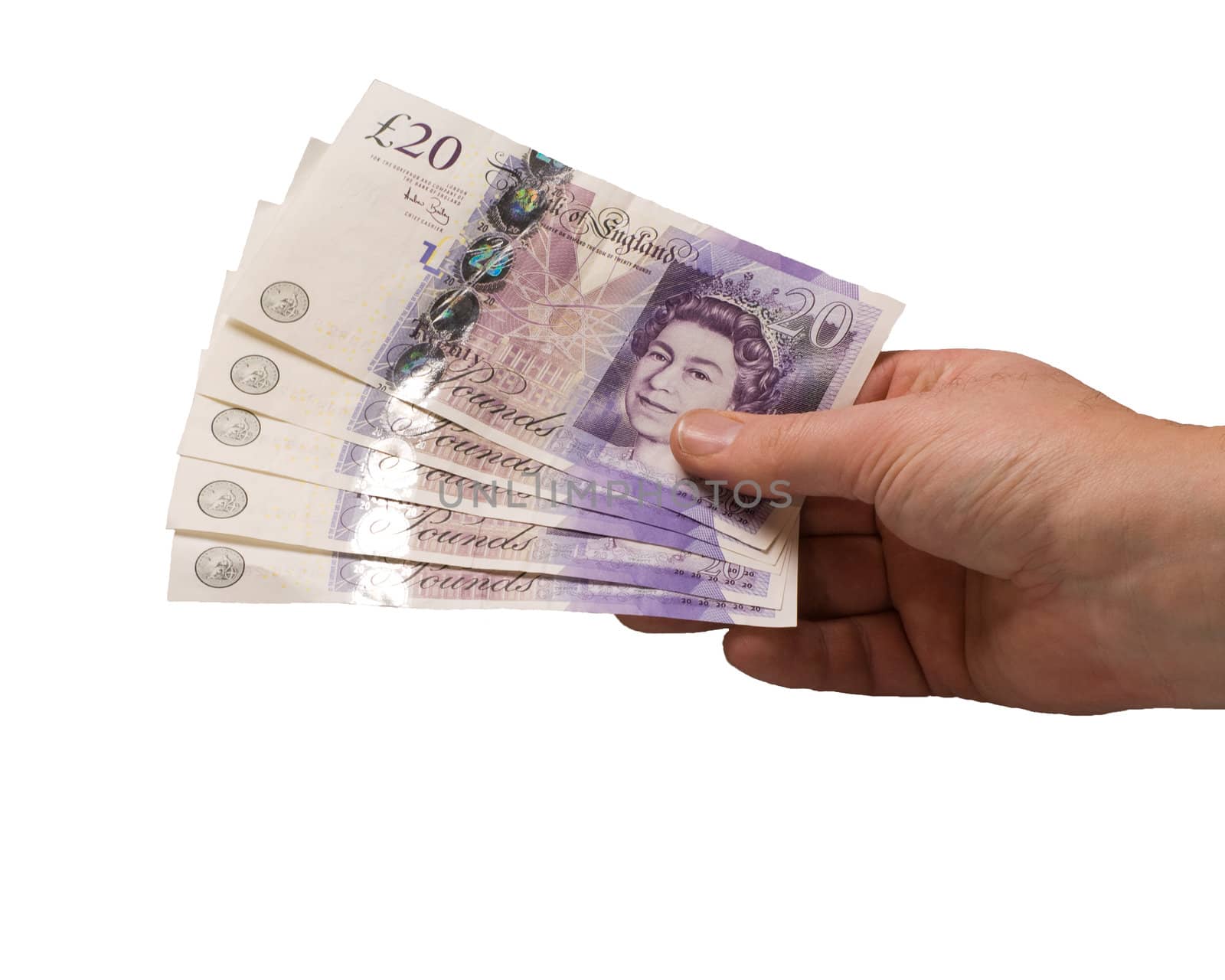 british pound notes being held in a hand holding out 