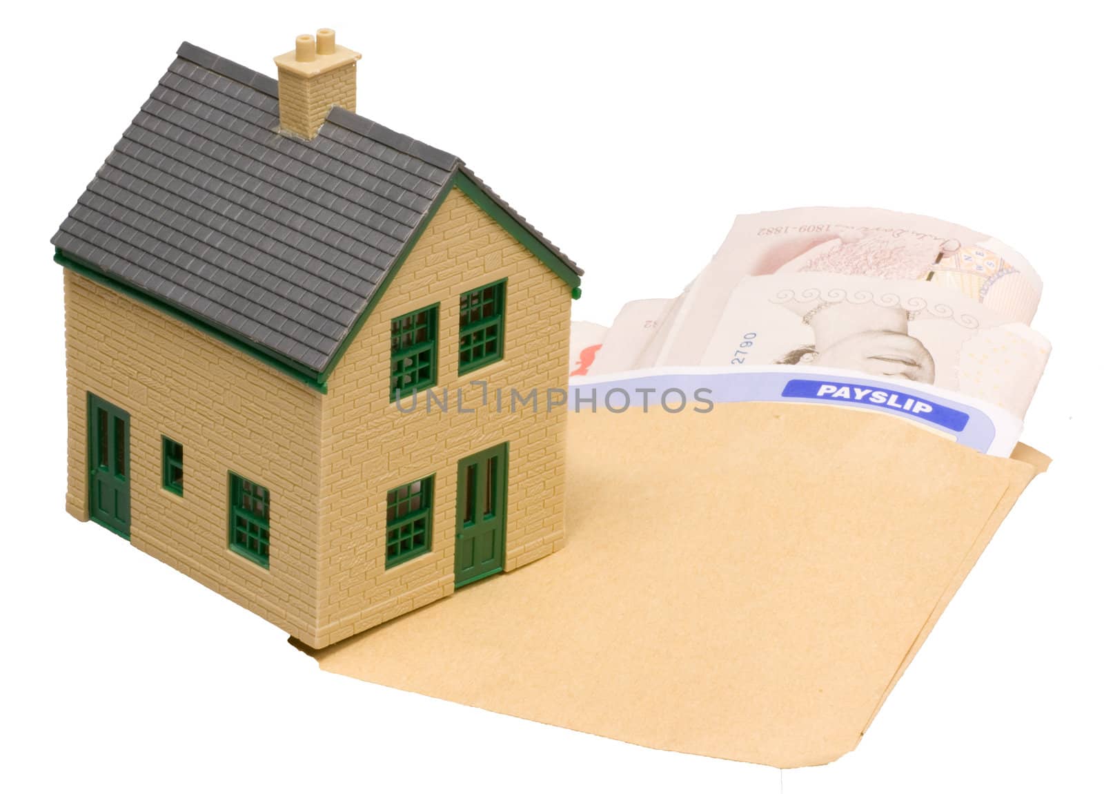 house and wage packet with payslip mortgage concept of buying propety
