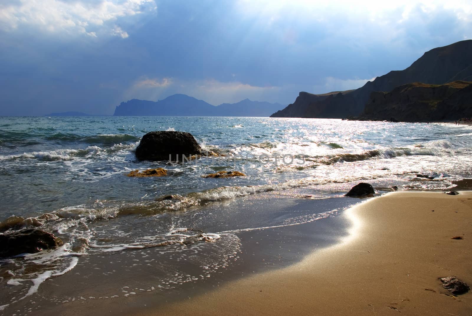 Coast of ocean. With picturesque mountains and the sky