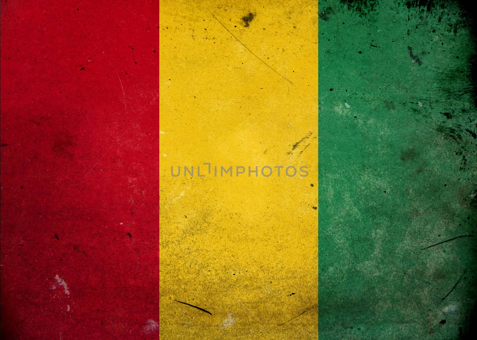 The flag of Guinea on old and vintage grunge texture