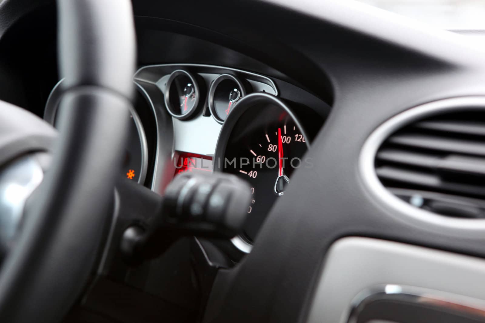 Illuminated car dashboard in red and black