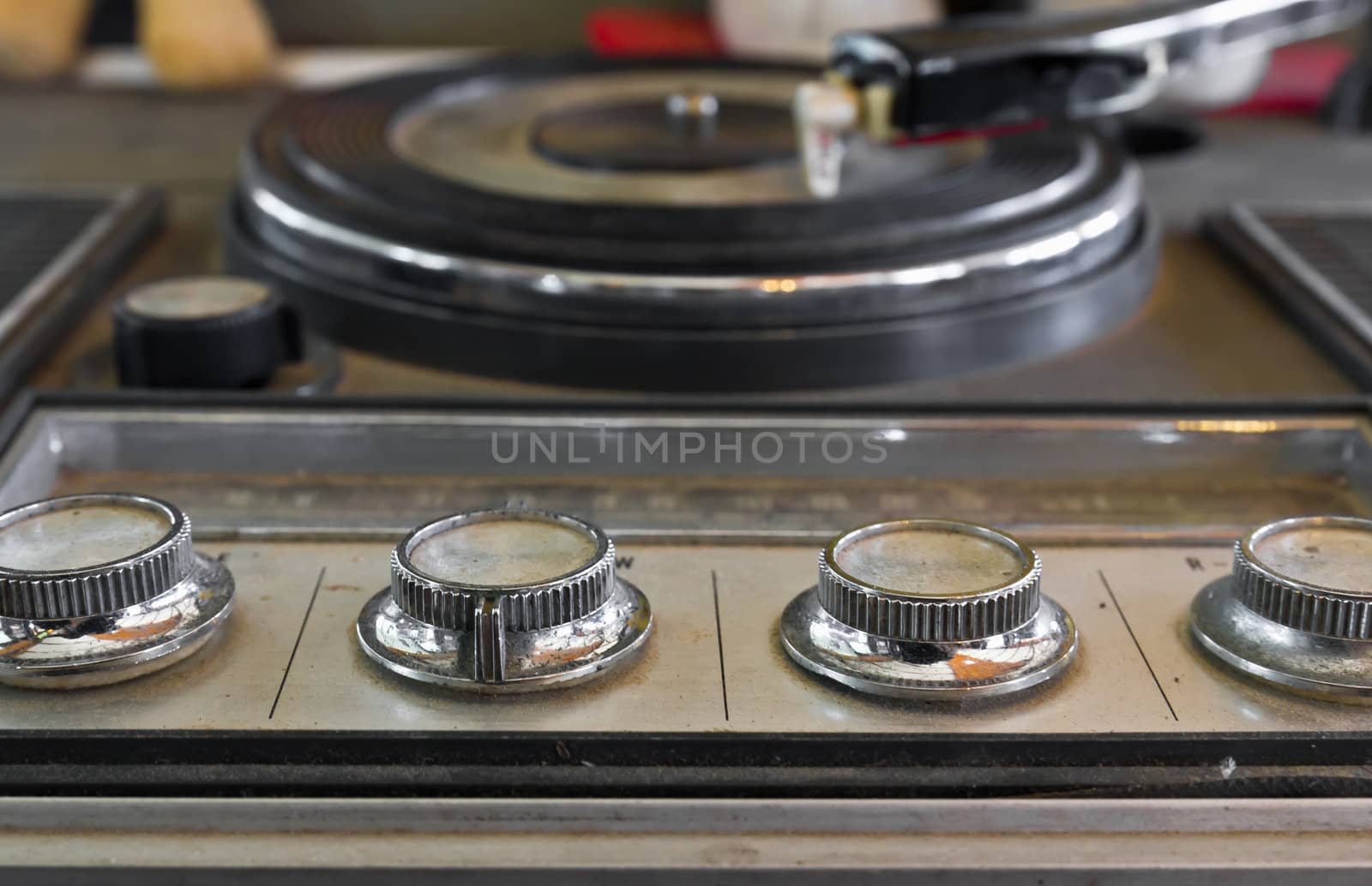 Old record-player with a scratched gramophone record