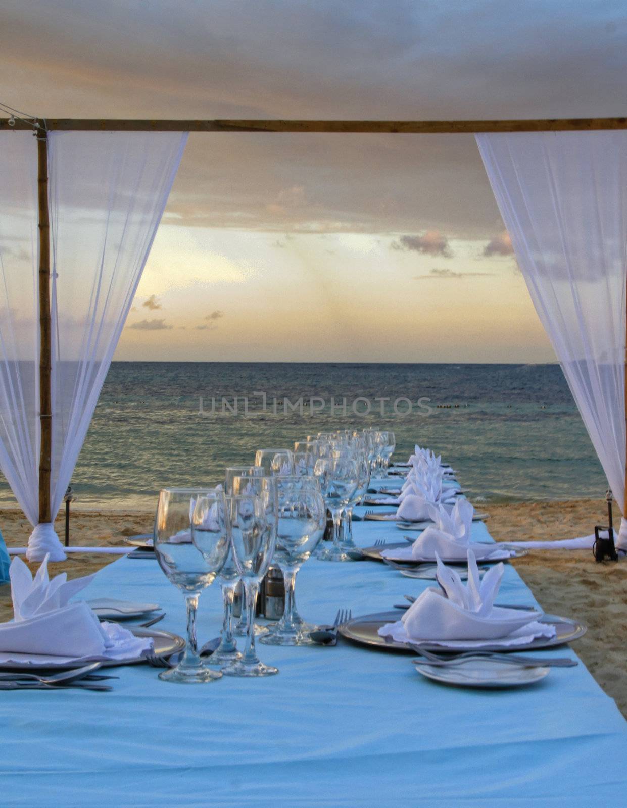 Exterior place setting for ocean side wedding celebration