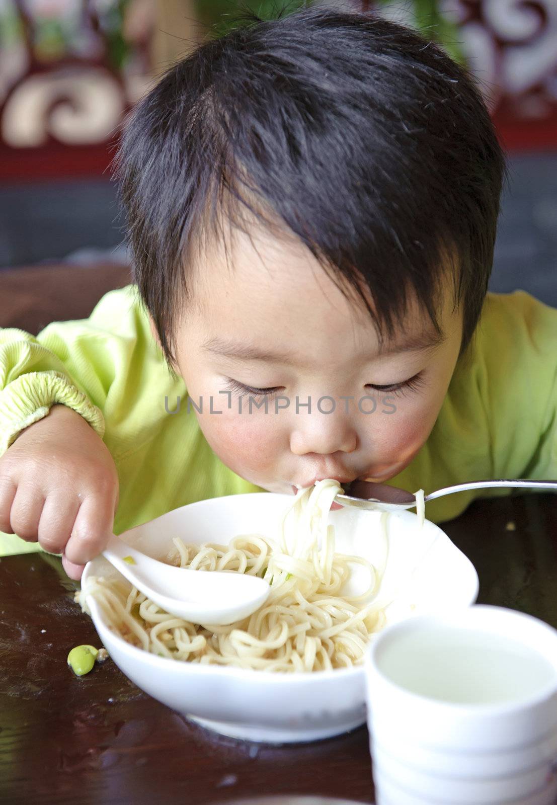 a cute baby is eating