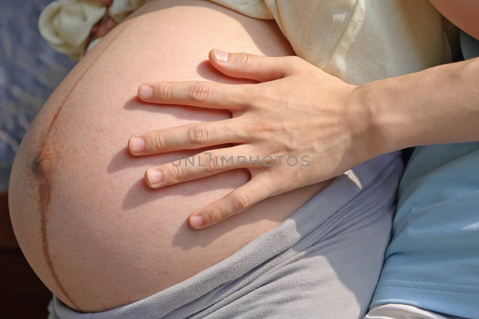 Pregnant woman and exposed belly