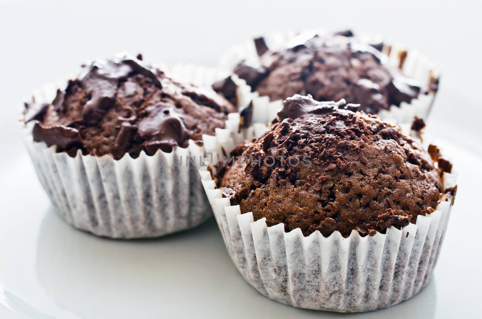 Chocolate muffins on the plate, high key, shallow DOF