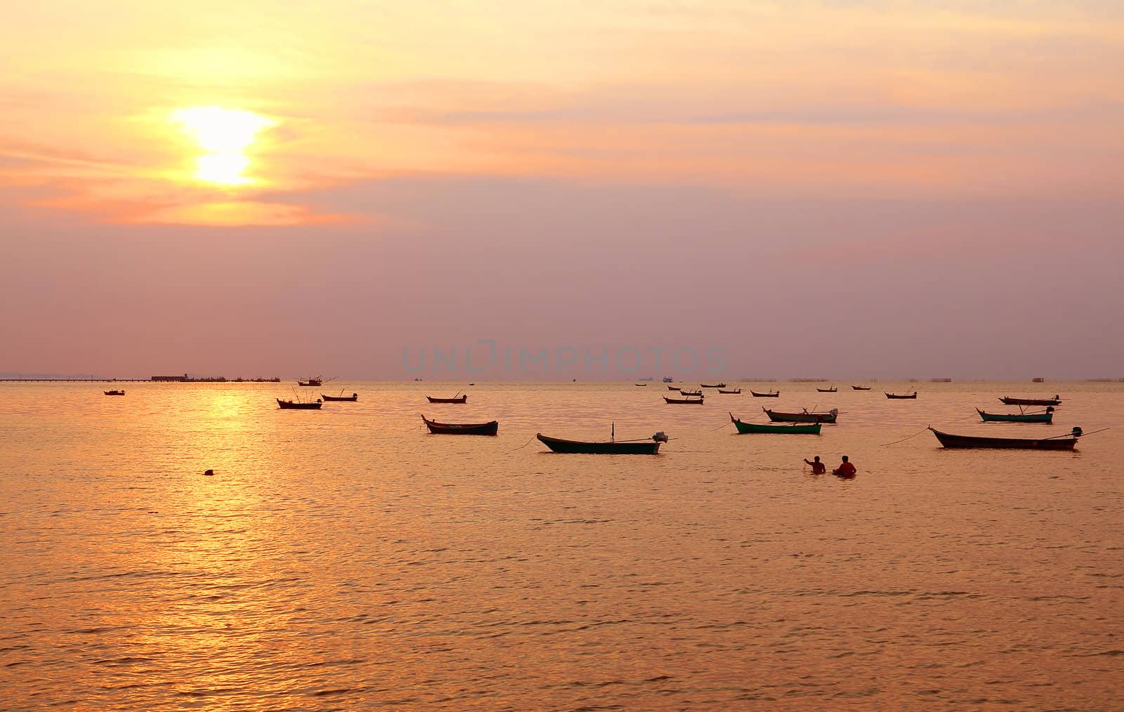 Fishing boats with sunset