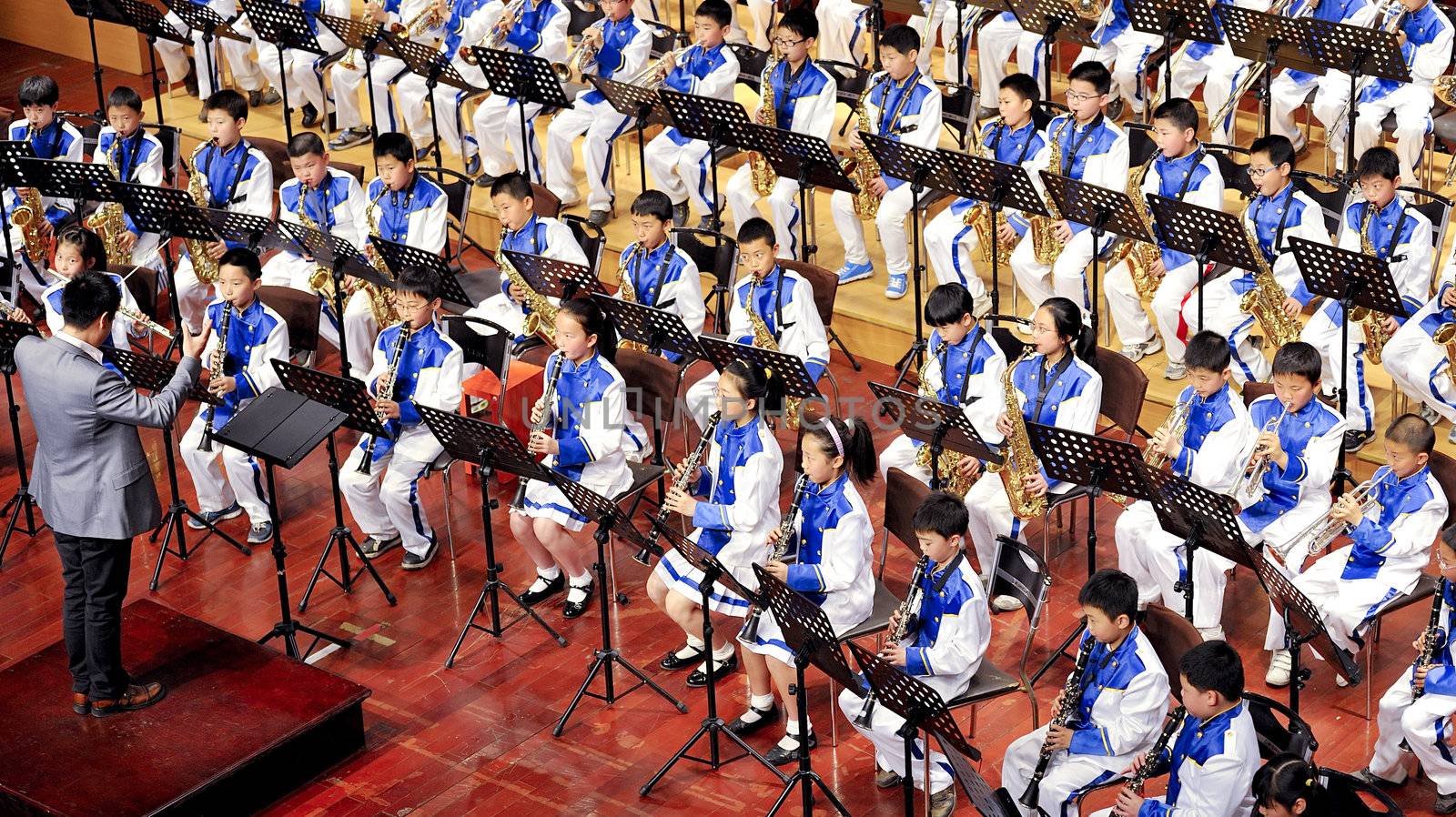 CHENGDU - APR 23: student symphonic band of High School No.7 Chengdu perform on concert on Apr 23,2011 in Chengdu,China.