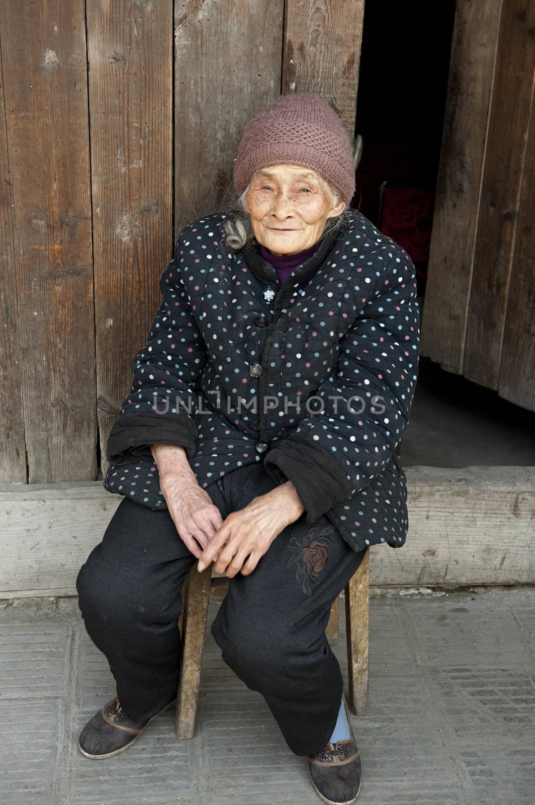 portrait of 90 years old woman in a town