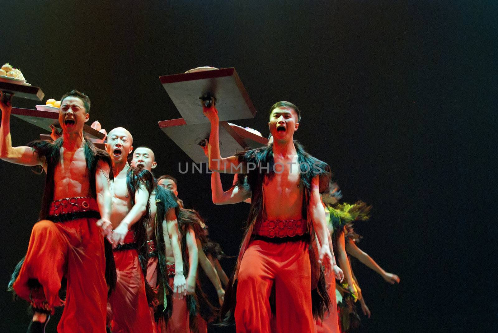 CHENGDU - DEC 10: Chinese ethnic dancers perform folk dance onstage at JINCHENG theater in the 7th national dance competition of china on Dec 10,2007 in Chengdu, China.