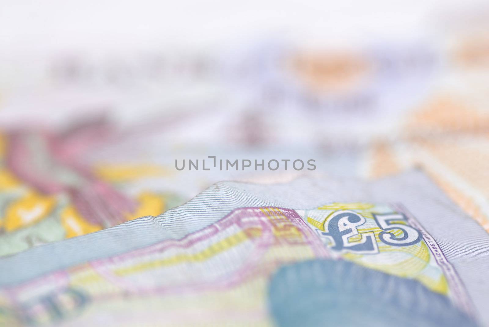 Macro image of English bank notes. Focus on �5 note.