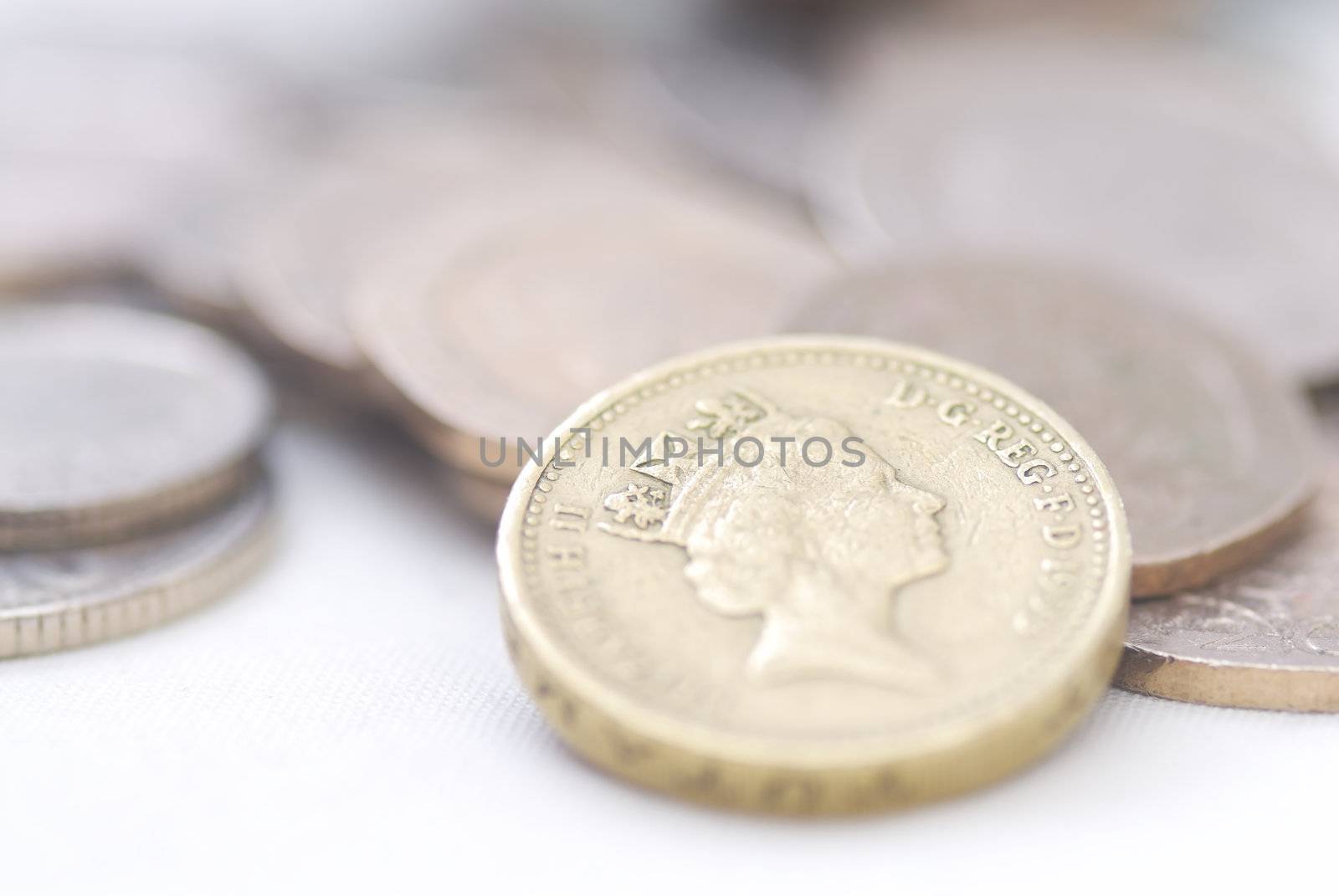 Spilled coins, focus on �1 coin. Sterling.